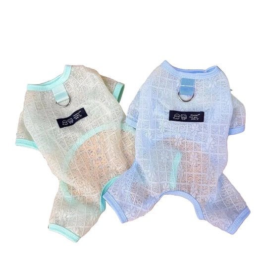Two mesh petcoats on a table with flowers in the background
