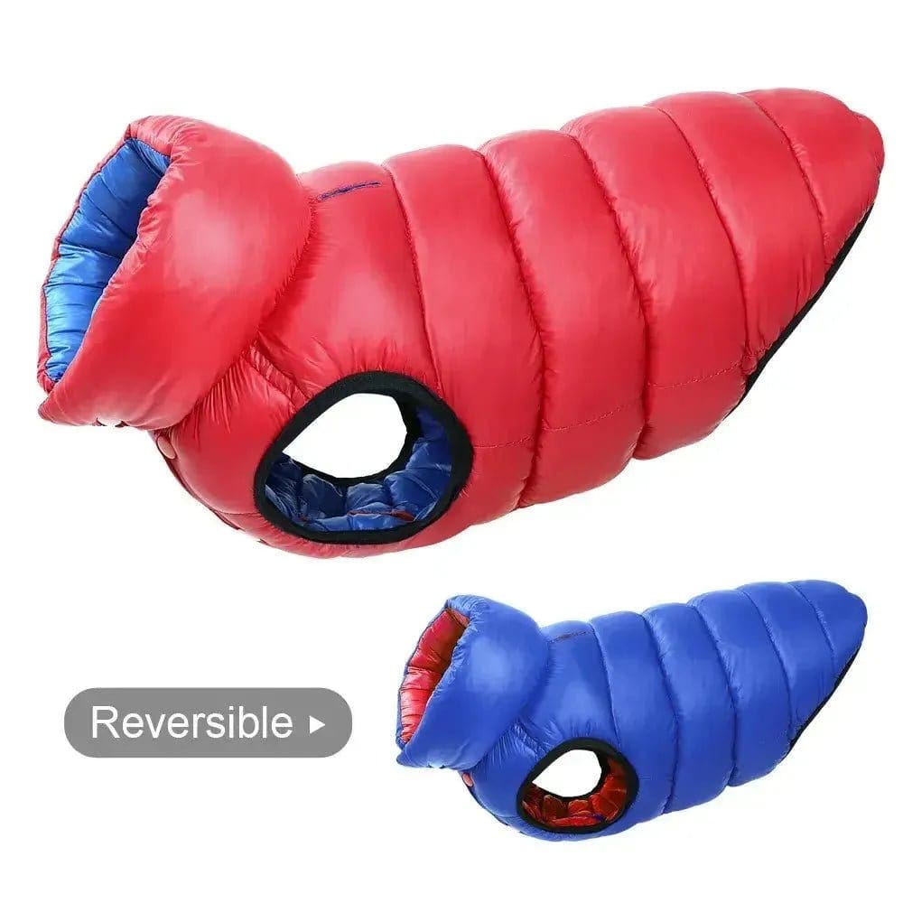 Two quilted reversible dog vests in red and blue fabric shown from the side against a white background.