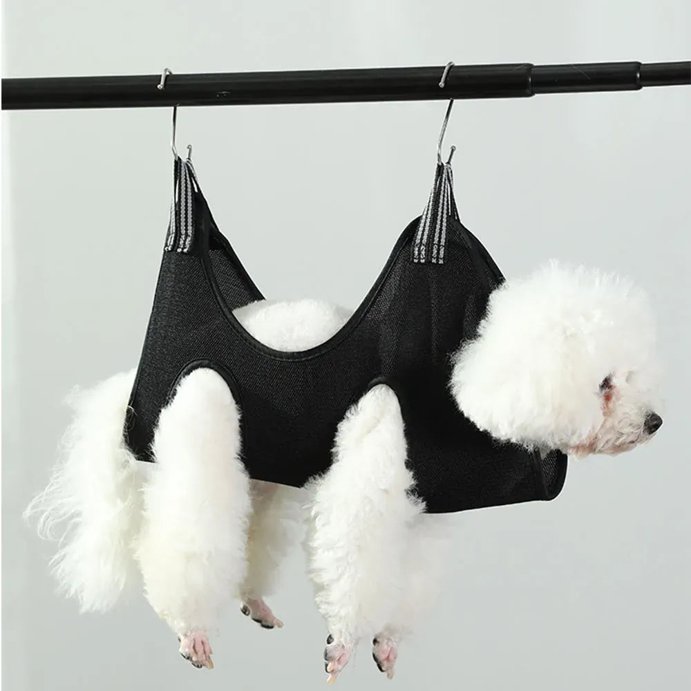 Two dogs inside a black pet hammock hanging from a rod.