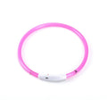 Pink plastic circular LED dog collar with a white plastic USB charging port and a scissor icon.