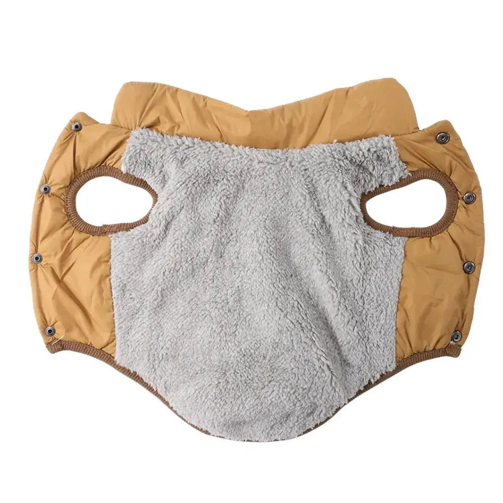 Tan fabric dog coat with grey fleece lining, snap buttons, and leg holes laid flat on a white background.