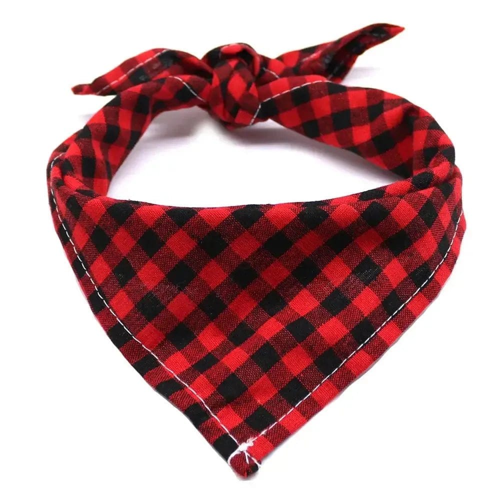 Red and black plaid fabric dog bandana tied in a knot, isolated on a white background.