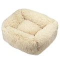 One square cream fabric pet bed with a shaggy plush texture and raised bolster sides.