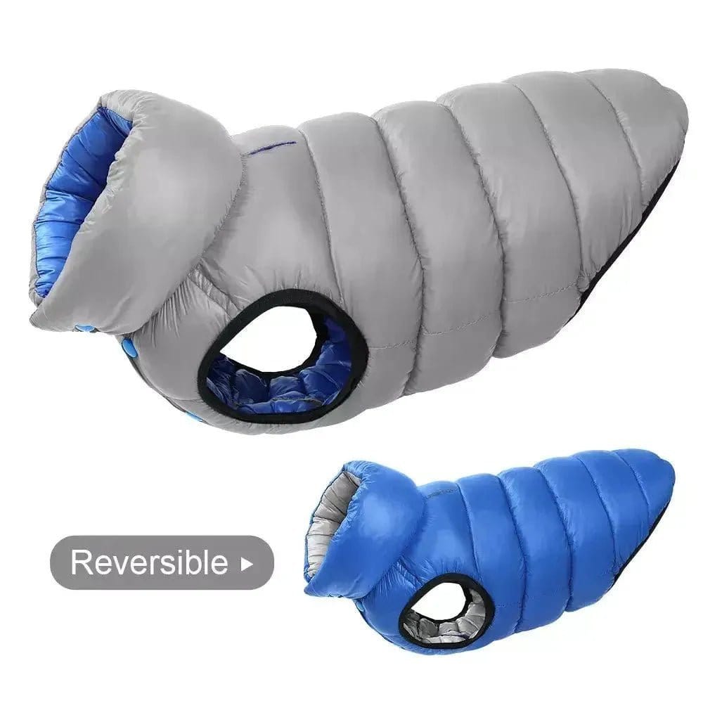 Two reversible quilted fabric dog vests in grey and blue shown from a side profile against a white background.