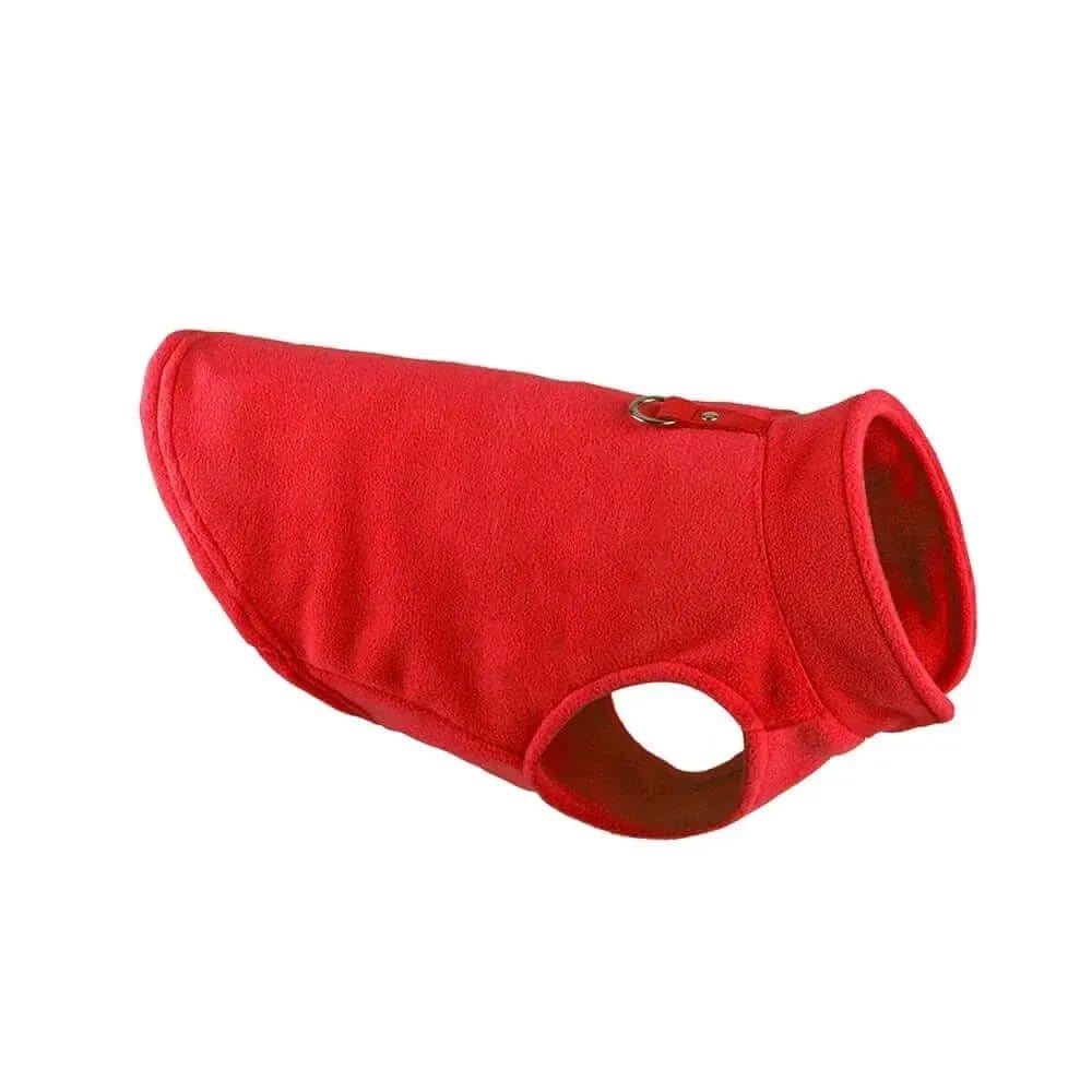 Red fabric dog jacket with a high collar, leg holes, and a metal leash attachment ring on the back.