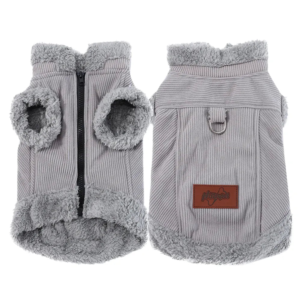Front and back view of a grey ribbed fabric dog vest with fleece lining, a black zipper, metal D-ring, and a brown logo pa...
