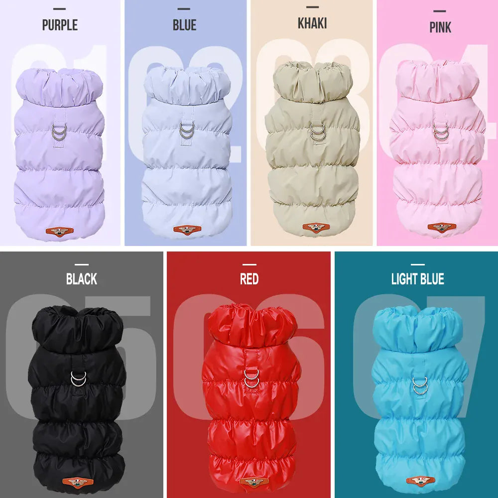 Seven quilted dog coats in purple, blue, khaki, pink, black, red, and light blue with metal D-rings and high collars.